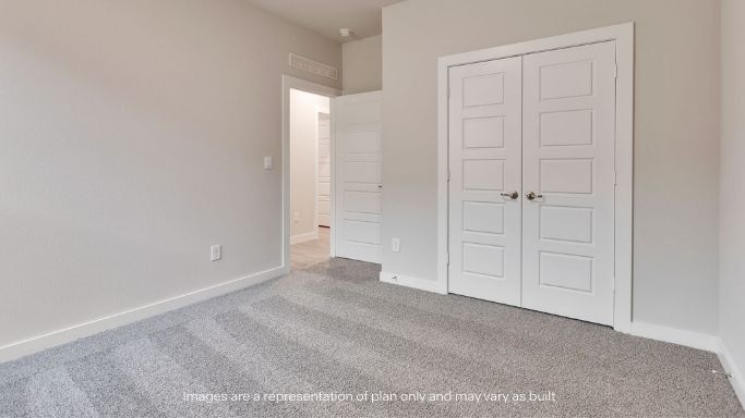 Guest bedroom 3 with plush carpet floors and spacious closet