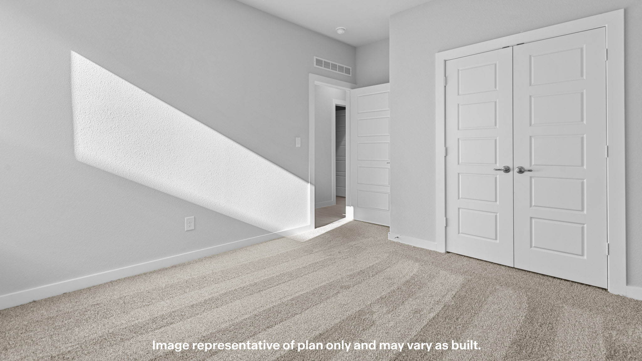Guest bedroom 2 with side window and plush carpet floor
