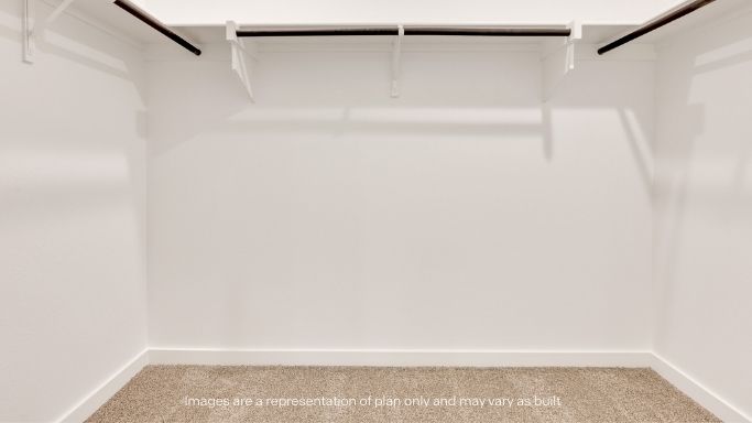 Primary walk-in closet with extra storage space