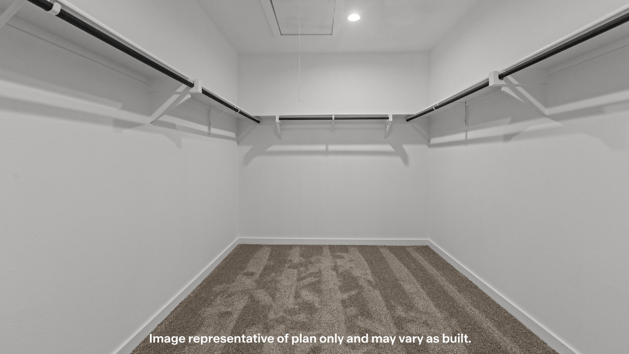 Private primary walk-in closet with extra storage space