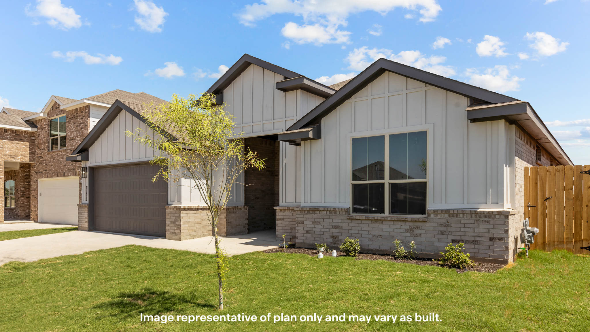 Single story farmhouse style home with front entry