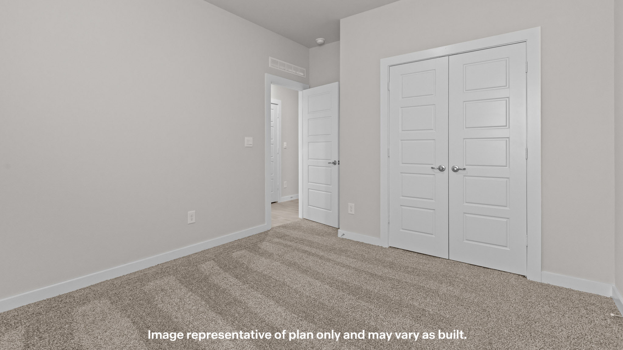 Guest bedroom 1 with front windows and ample natural light