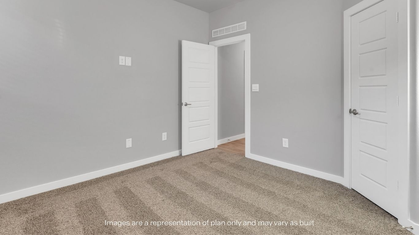 Guest bedroom 3 with plush carpet floors and spacious closet