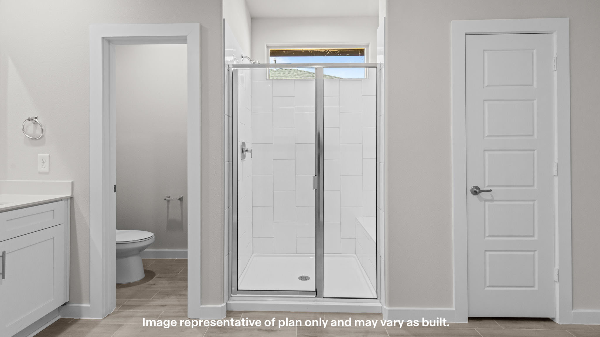 Primary bathroom with luxurious shower and built in storage
