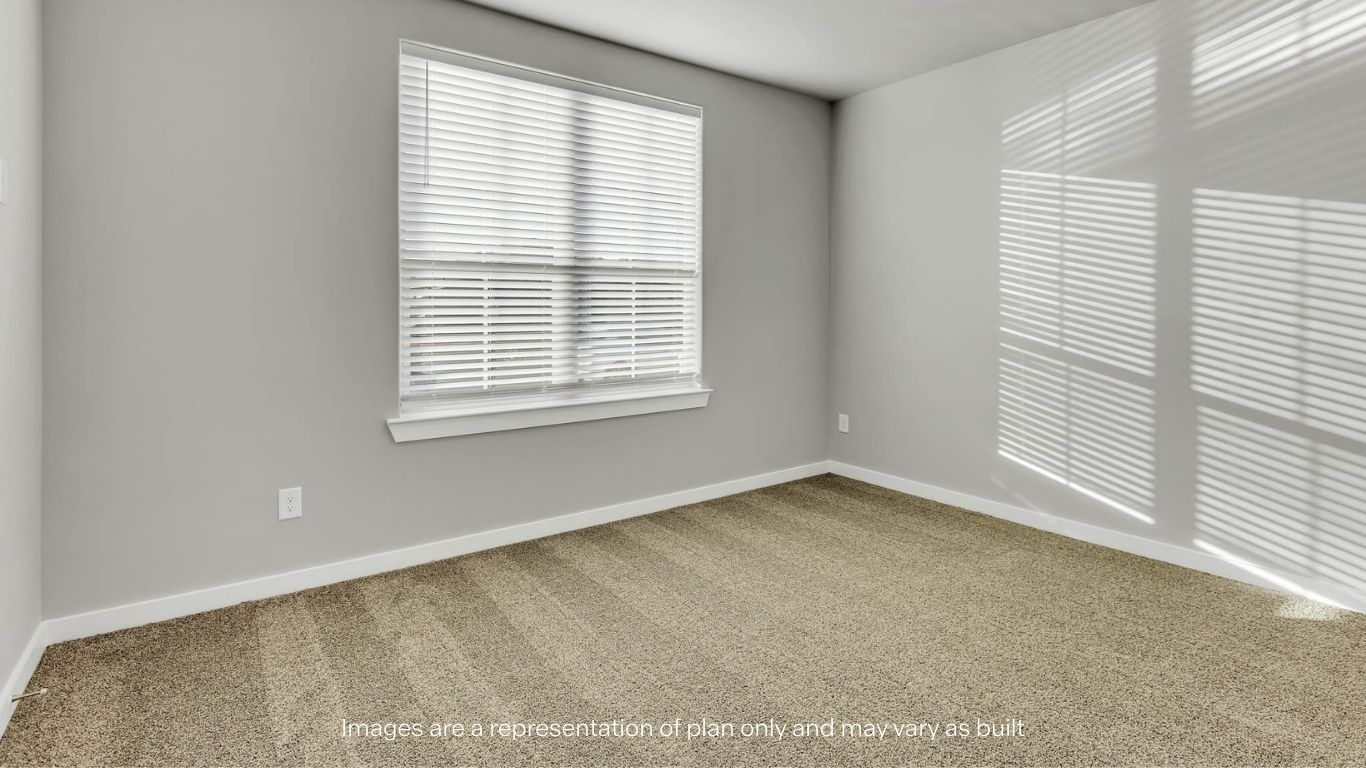 Guest bedroom 1 with front windows and ample natural light