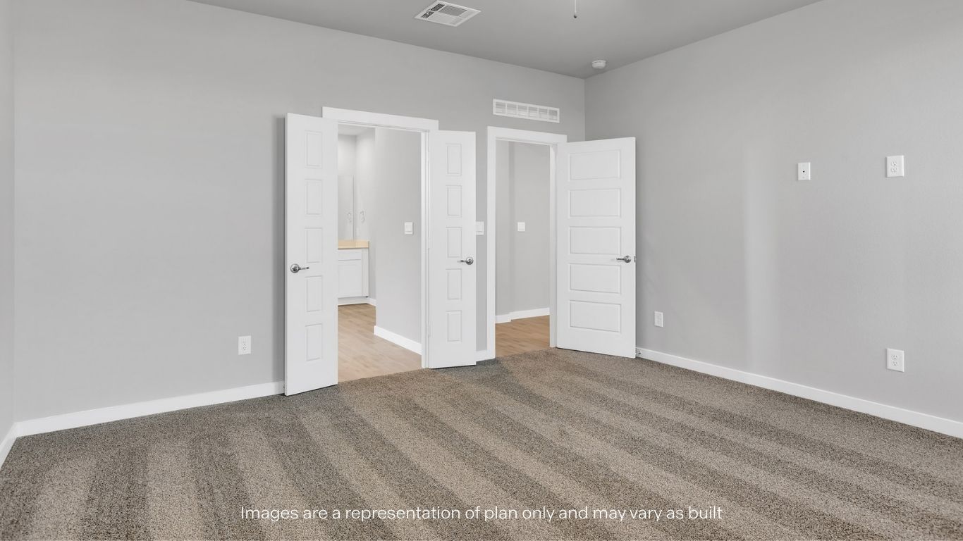 Primary bedroom with plush carpet floors and light allowing double windows