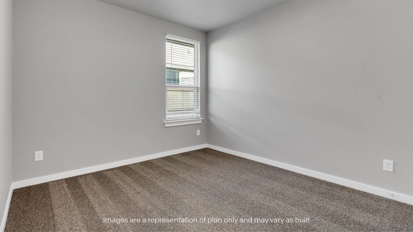 Guest bedroom 1 with front windows and ample natural light