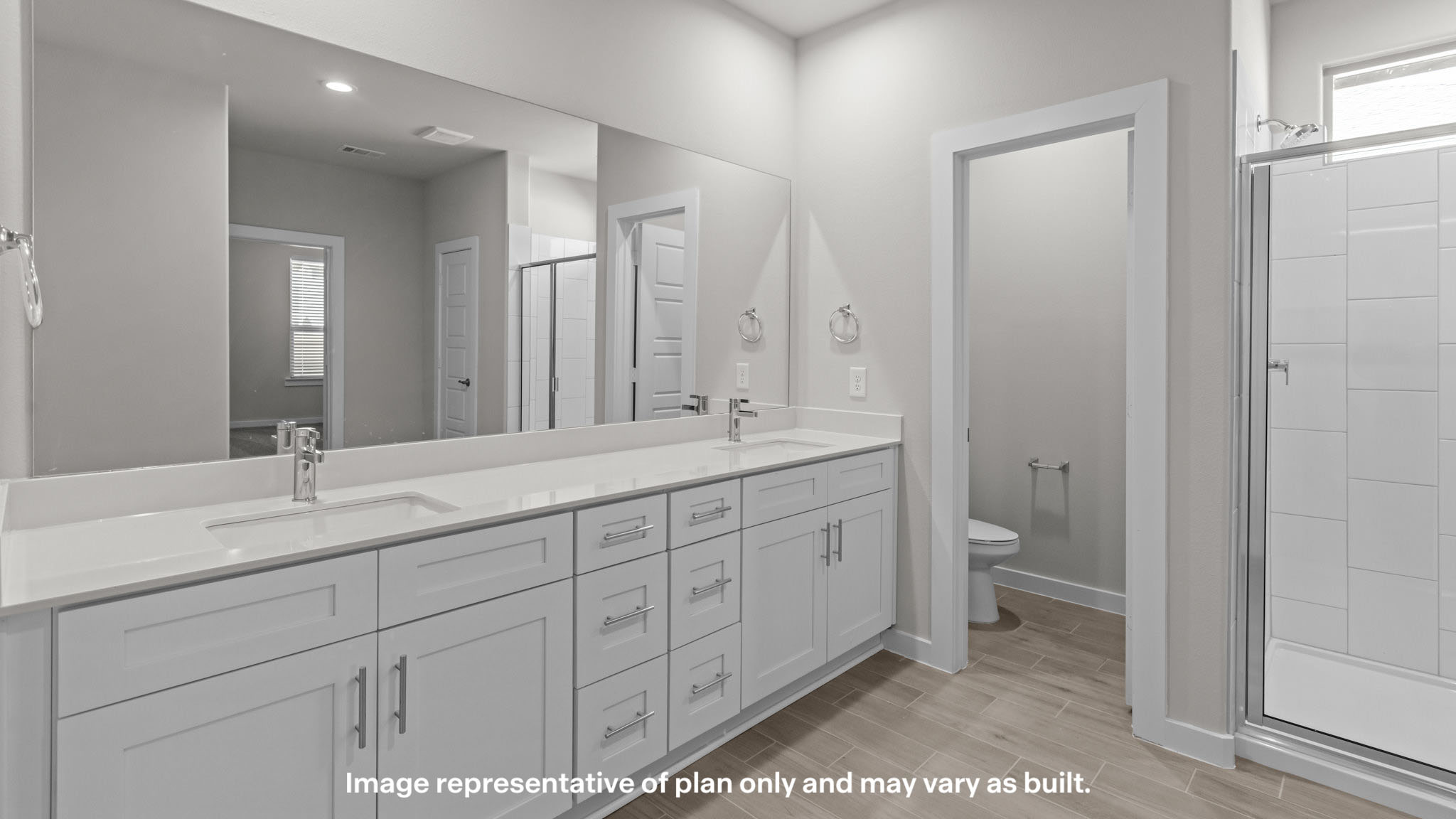 Primary bathroom with private water closet and walk-in closet