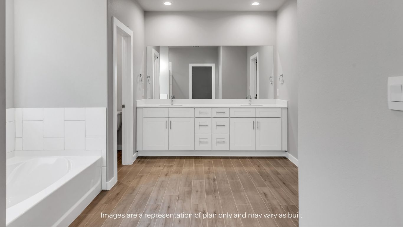 Private attached primary bathroom with built in vanity