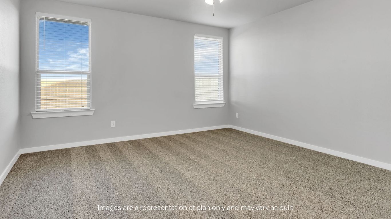 Guest bedroom 4 with plush carpet and side window