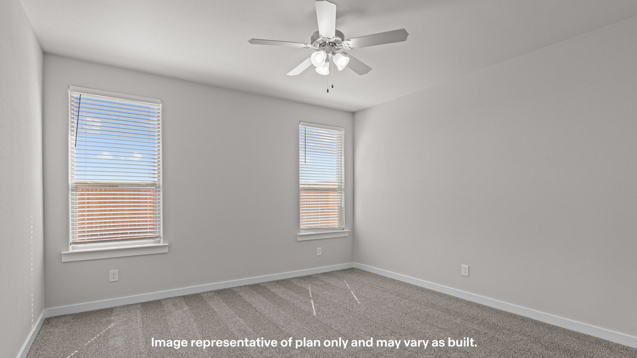 Primary bedroom with plush carpet floors and double light allowing windows
