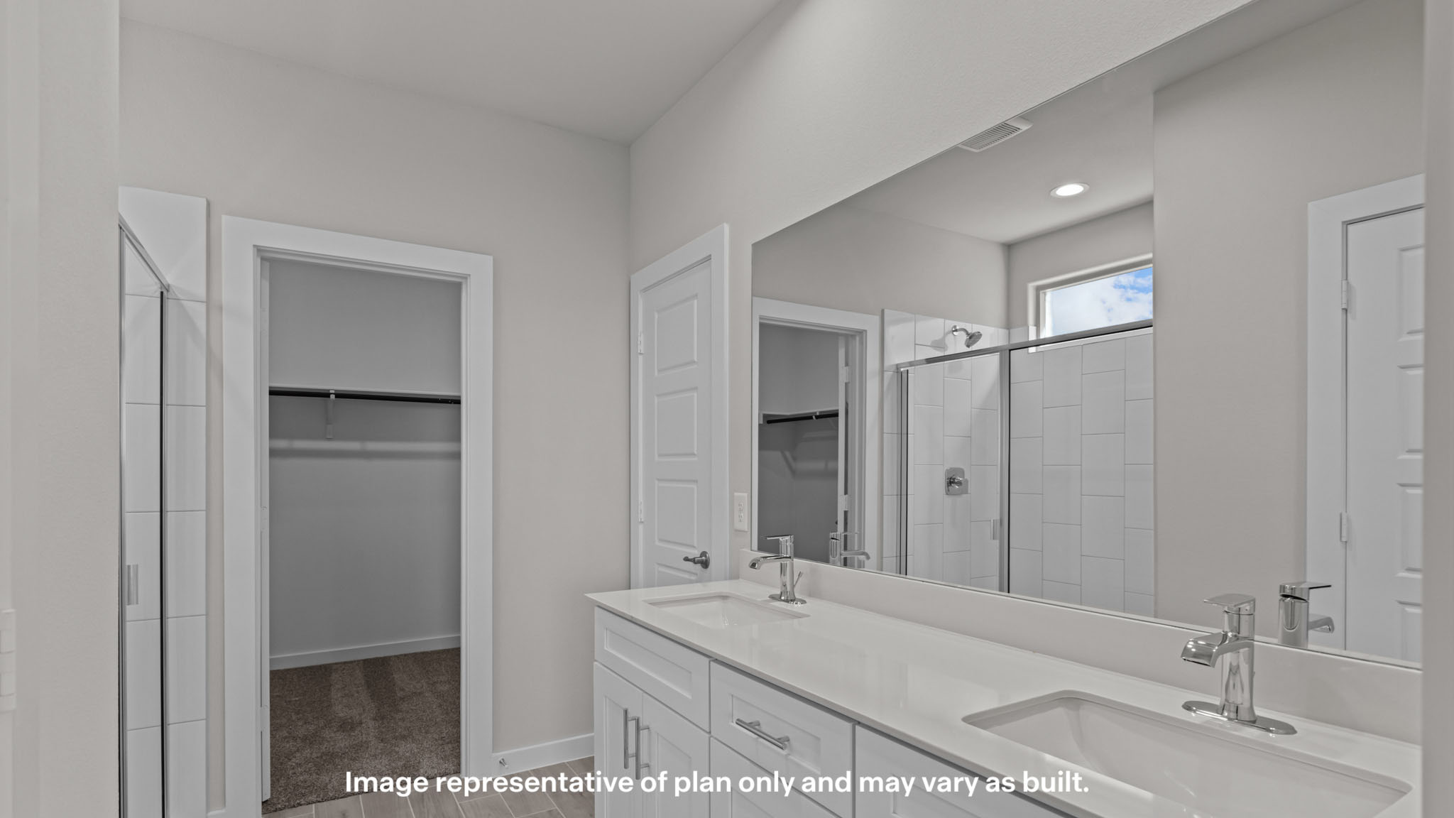 Private attached primary bathroom with built in vanity