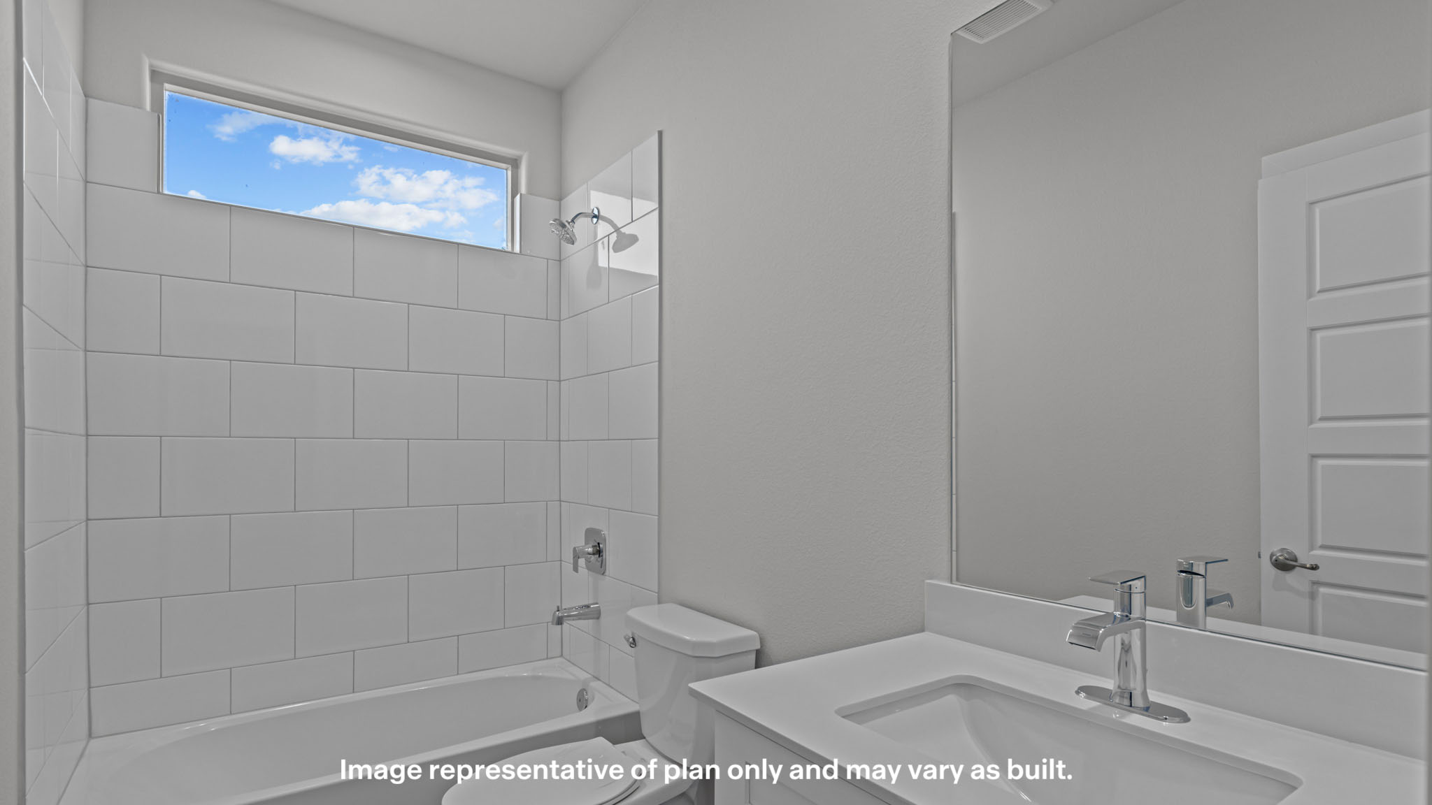 Upstairs guest bathroom with combination shower and bathtub