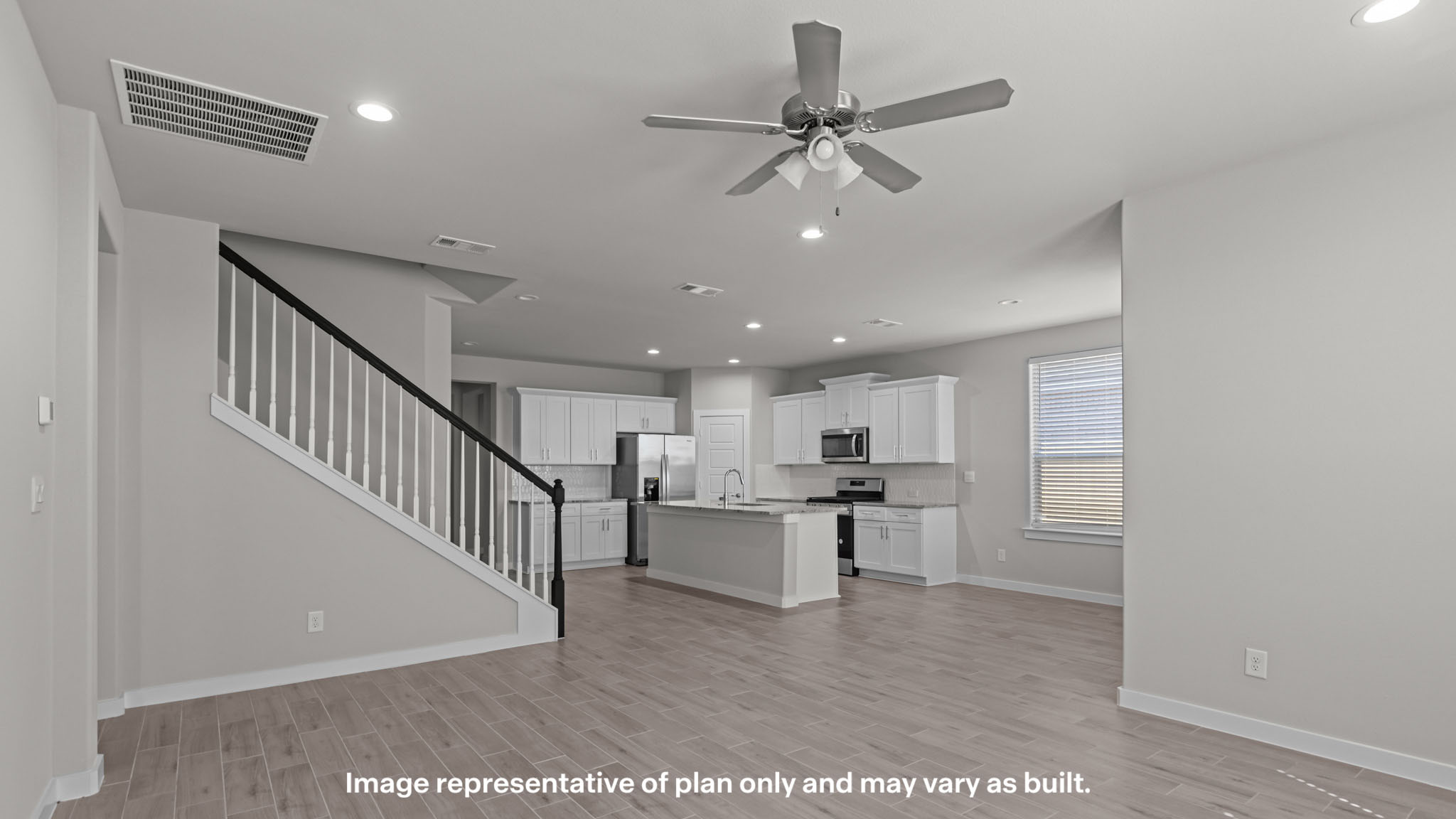 Open concept kitchen, living, family, and dining room space