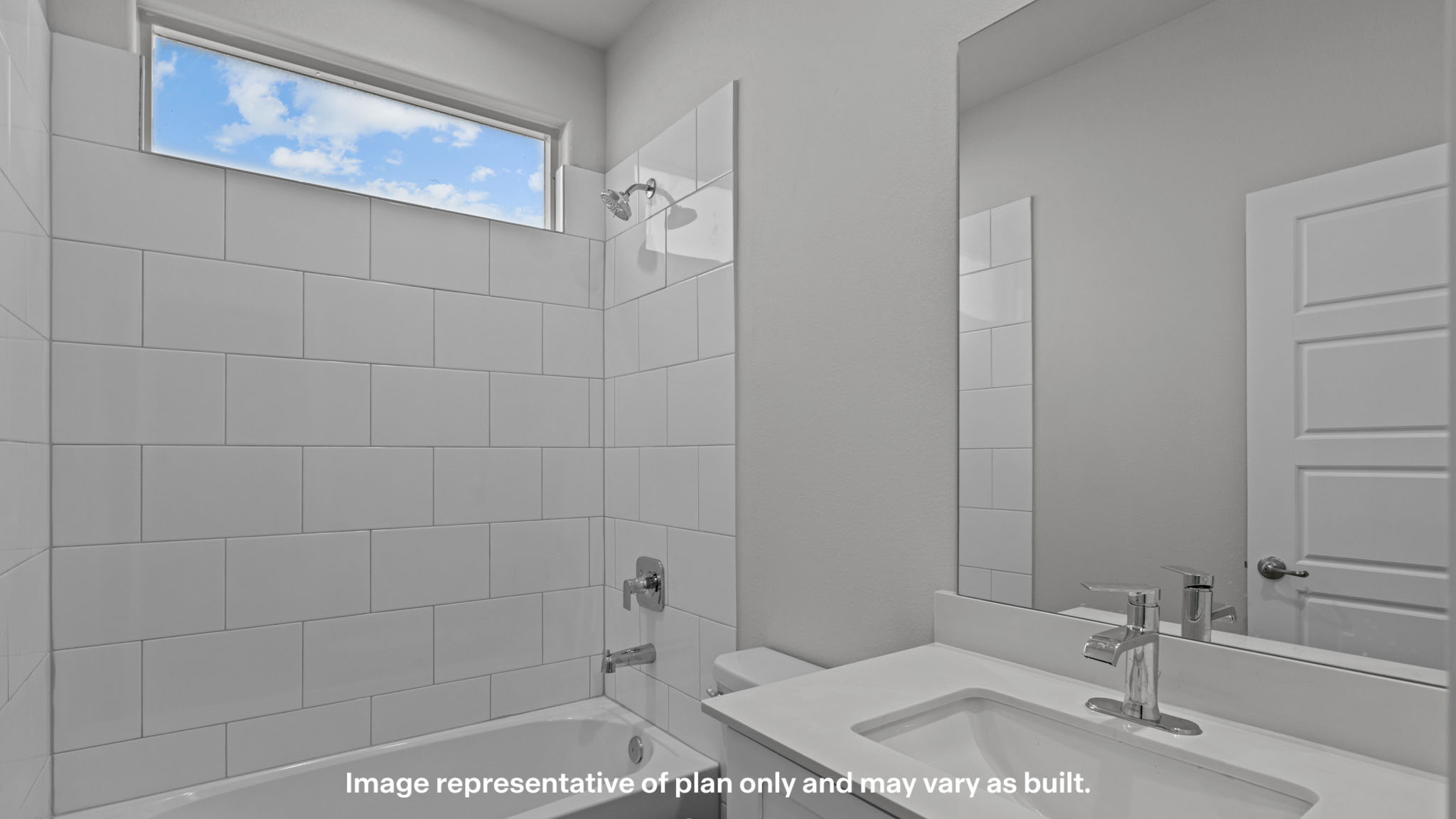 Upstairs guest bathroom with combination shower and bathtub