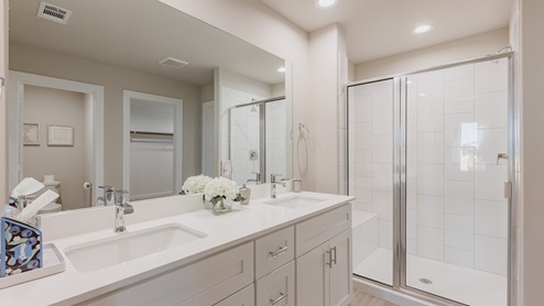 bathroom sink with white cabinets and mirrror