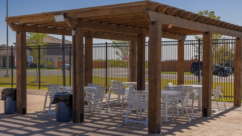 Neighborhood amenities poolside pavilion with lounge chairs