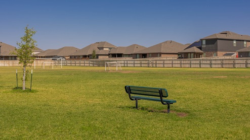 Neighborhood amenities soccer field with bench