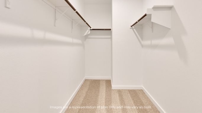 Primary walk-in closet with extra storage space