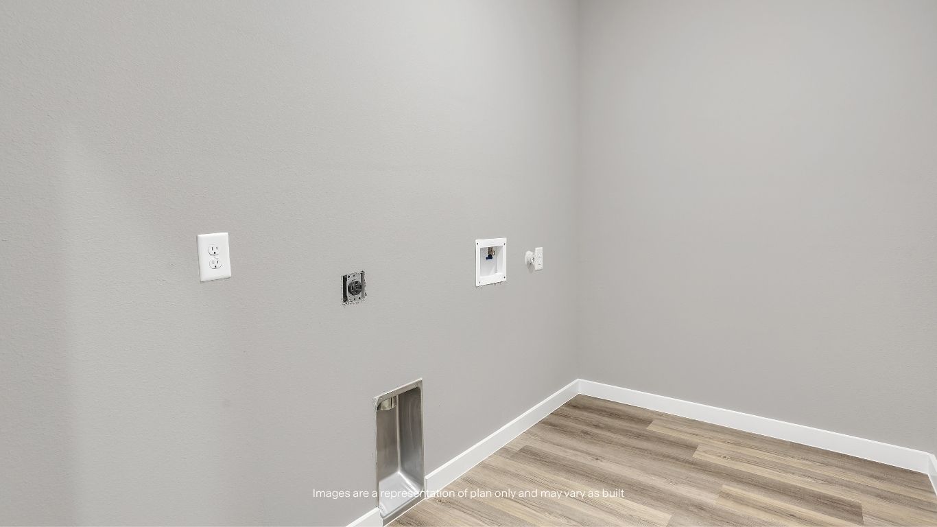 Conveniently located within the home, the dedicated laundry room offers ample space for a washer and dryer, making everyday chores simple and efficient.