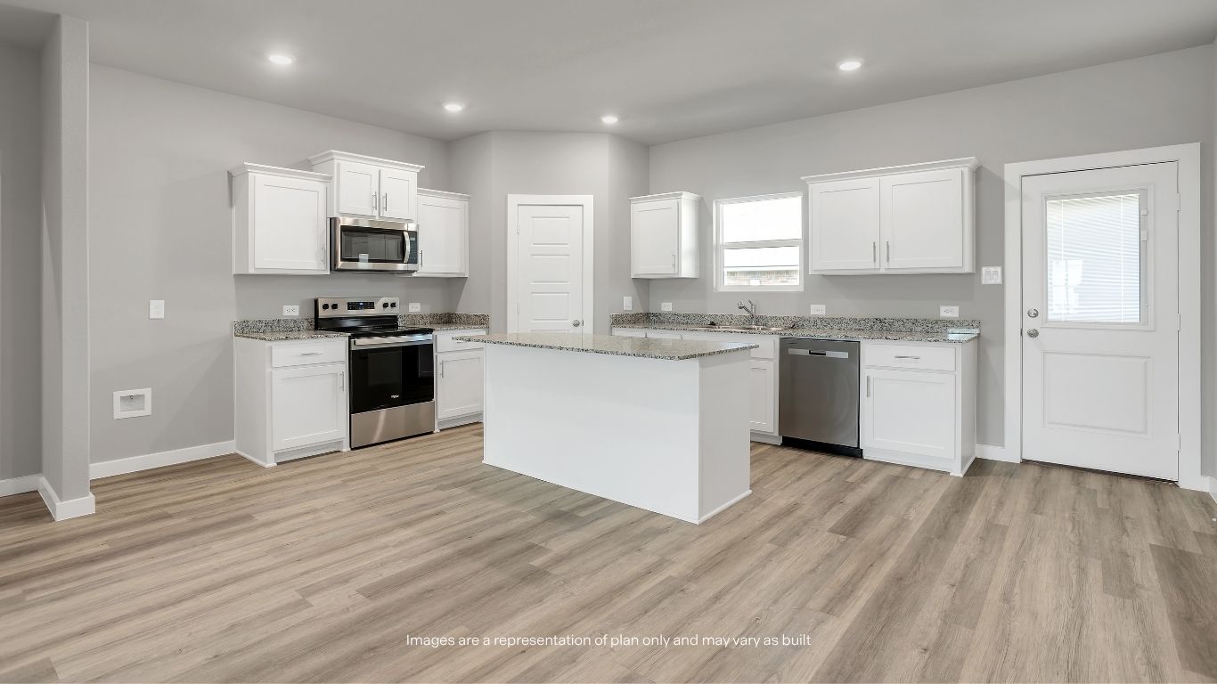 This expansive gathering area is ideal for everyday living, allowing everyone to stay connected whether cooking, dining, or relaxing.