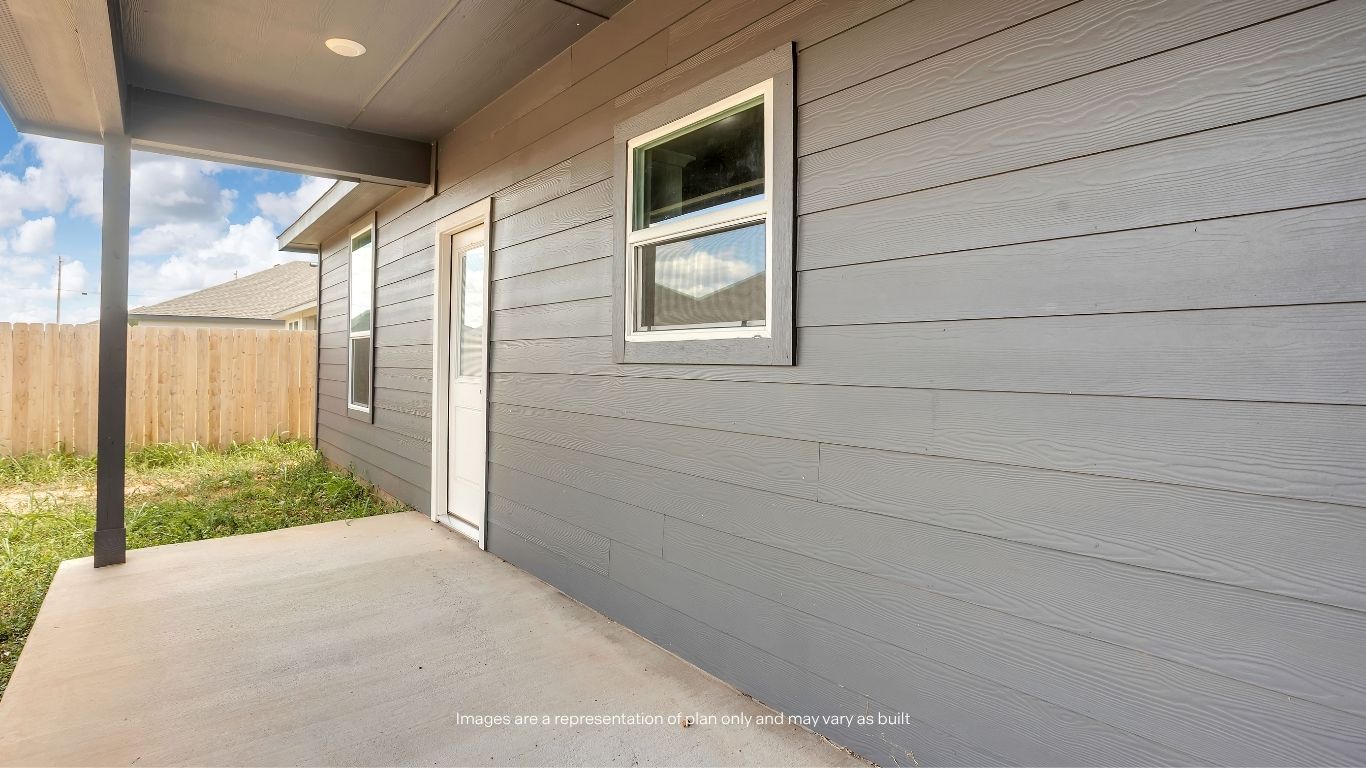 Step outside to a spacious covered patio, perfect for enjoying your morning coffee, entertaining guests, or relaxing in the shade while overlooking the backyard.