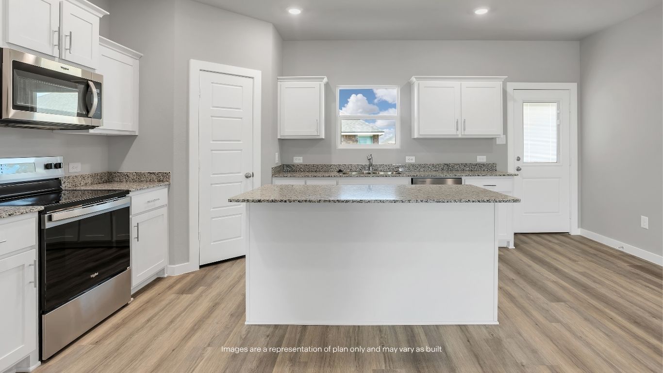The kitchen features a large center island, granite countertops, shaker-style cabinetry, stainless steel appliances, and ample storage space.