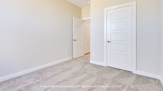 Guest bedroom 3 with plush carpet floors and spacious closet