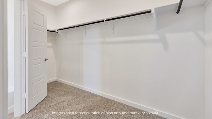 Primary walk-in closet with extra storage space