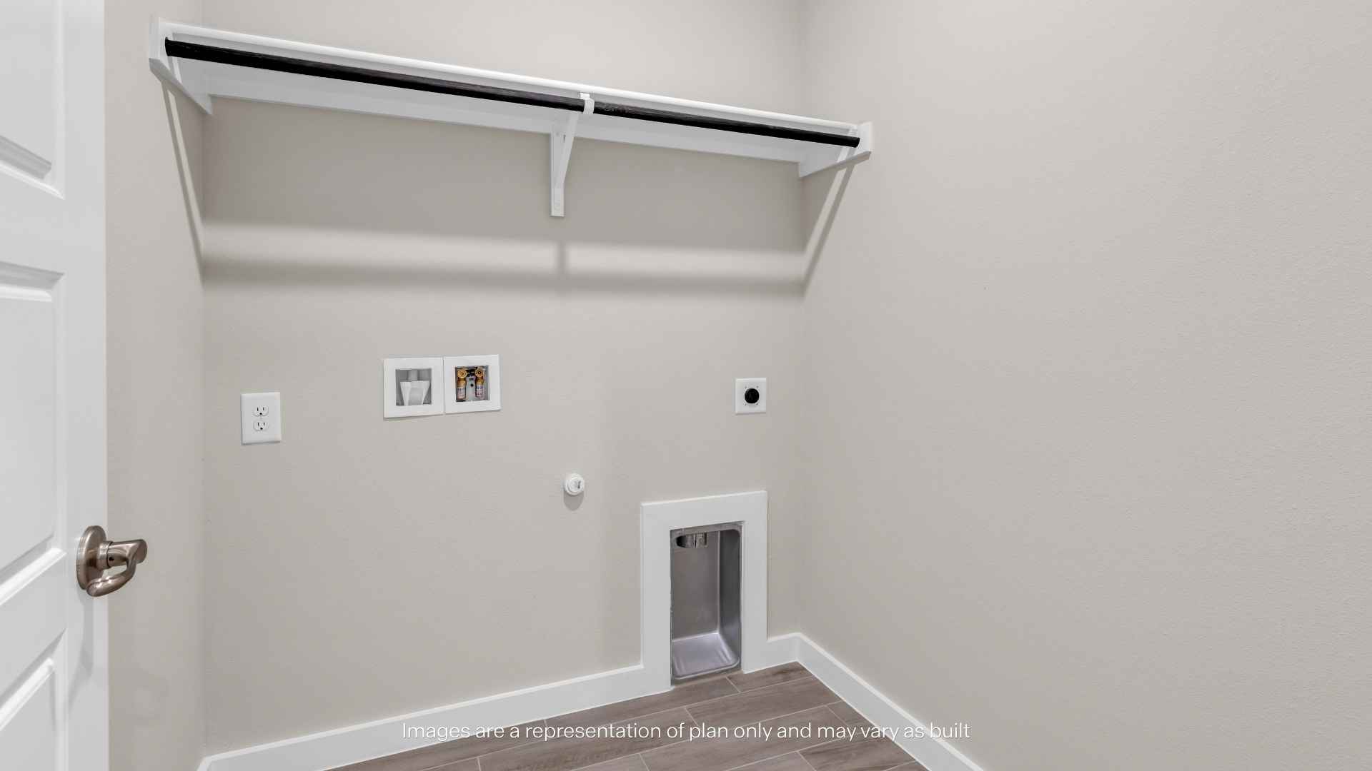 Laundry room with utility hookups, wall-mounted shelf, hanging rod, recessed dryer vent connection, and wood-look tile flooring.