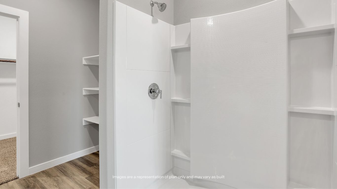 The private ensuite bathroom features a large vanity, modern fixtures, and a thoughtfully designed layout.