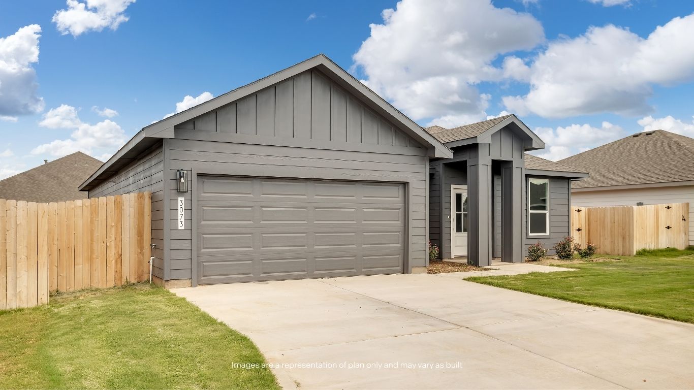 The thoughtfully designed exterior showcases contemporary architectural details, low-maintenance landscaping, and a generous driveway.