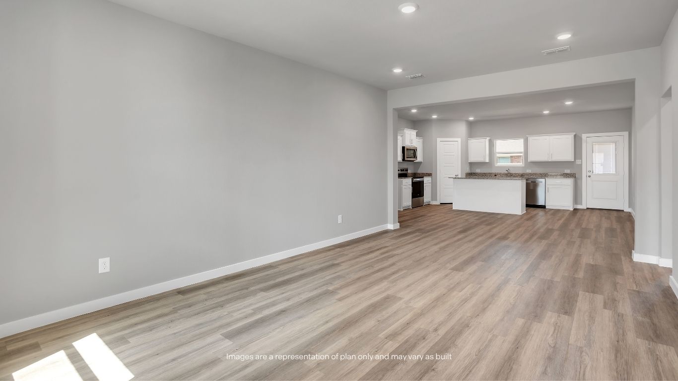 Enjoy seamless flow between the living room, dining area, and kitchen in this bright and functional open-concept design.
