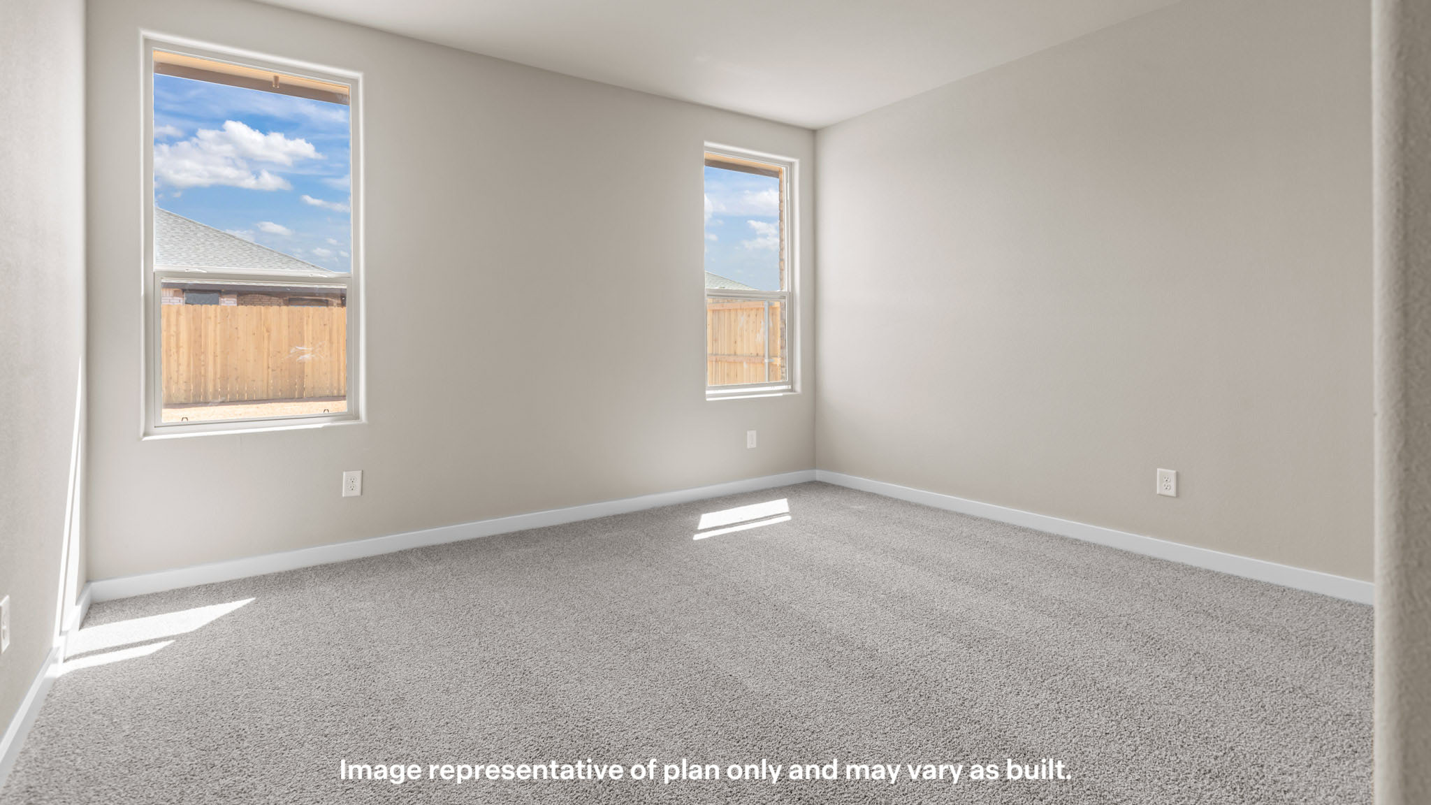 Primary bedroom with plush carpet floors and light allowing double windows