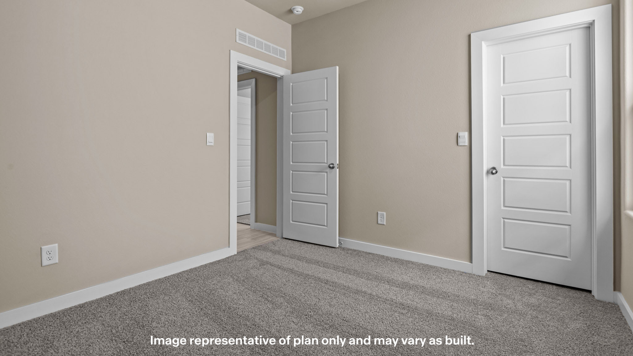 Guest bedroom 2 with plush carpet floors and walk-in closet