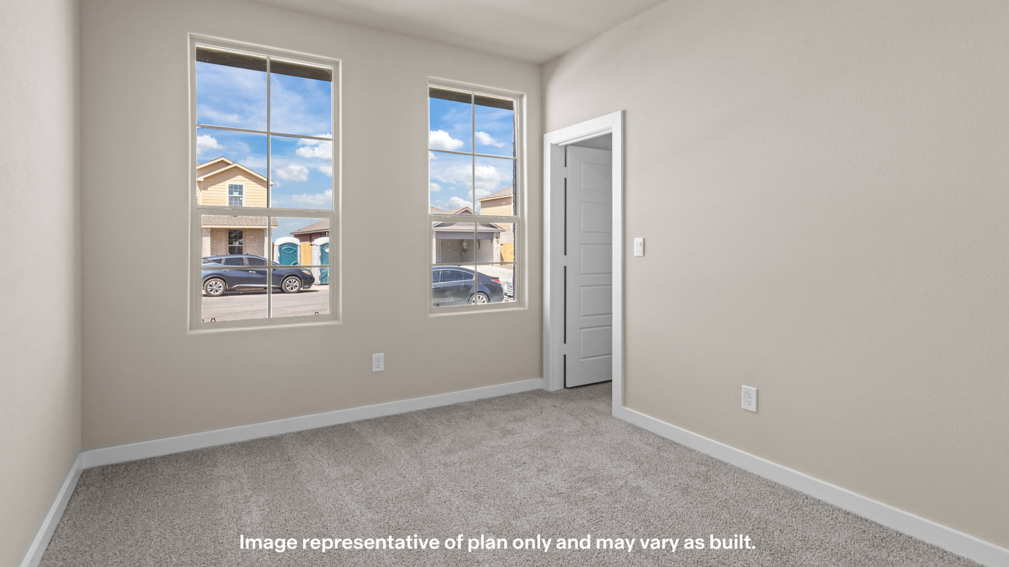 Guest bedroom 1 with front windows and ample natural light