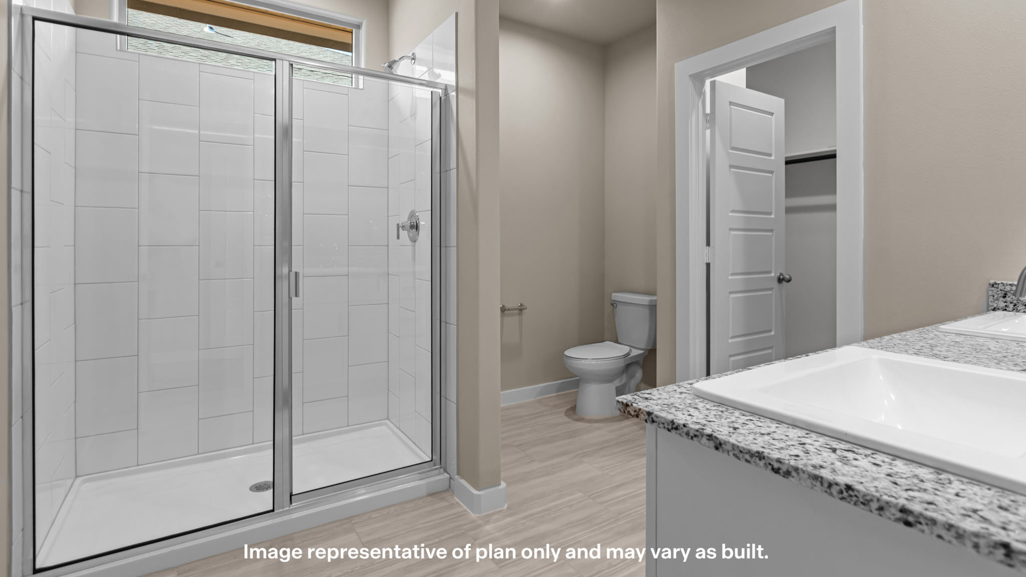 Primary bathroom with luxurious shower and built in storage