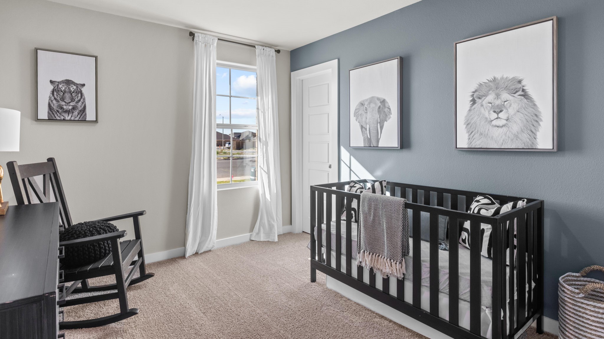 Guest bedroom 1 with front windows and ample natural light