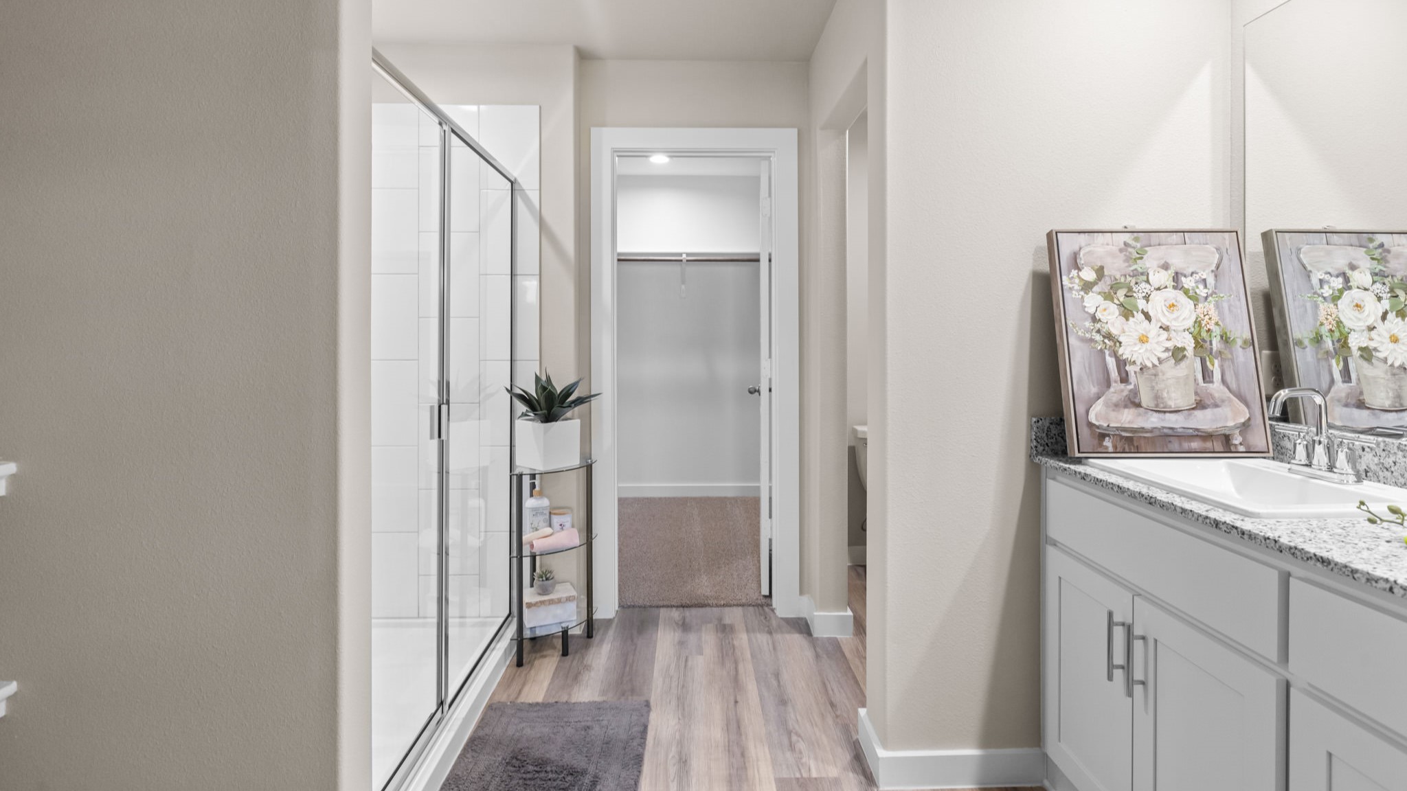 Primary bathroom with luxurious shower and built in storage