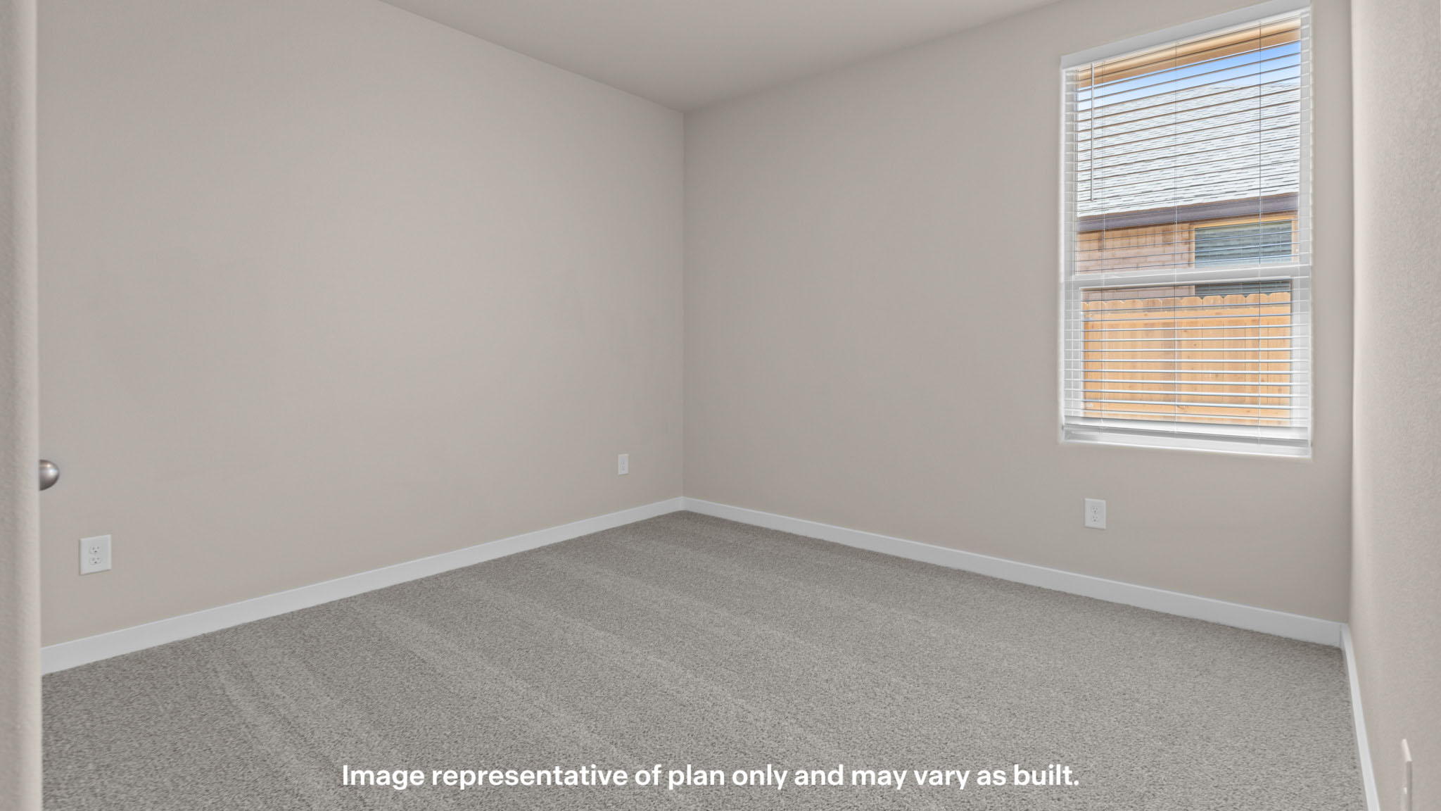 Guest bedroom 2 with side window and plush carpet floor