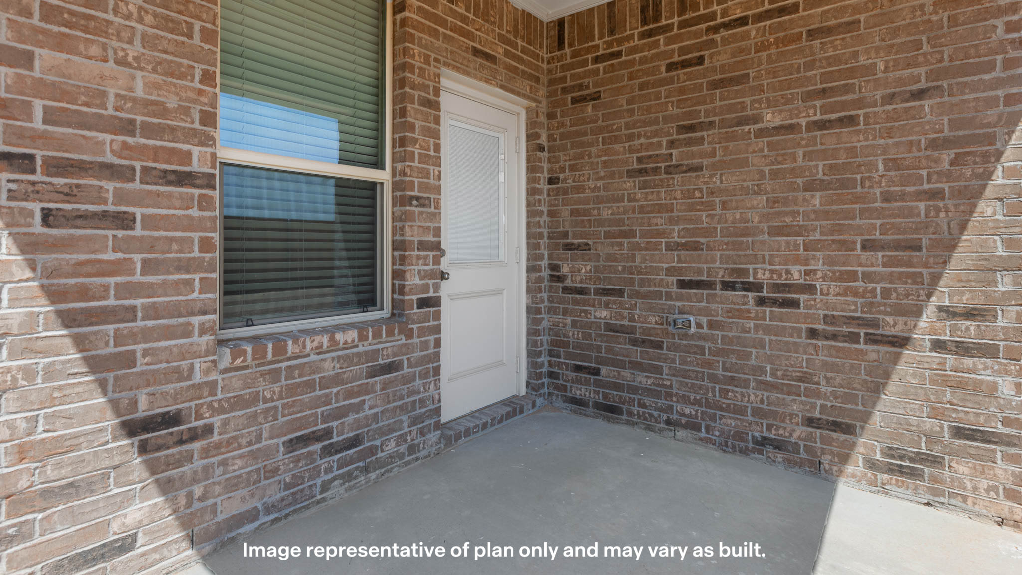 Covered back patio area overlooking spacious backyard