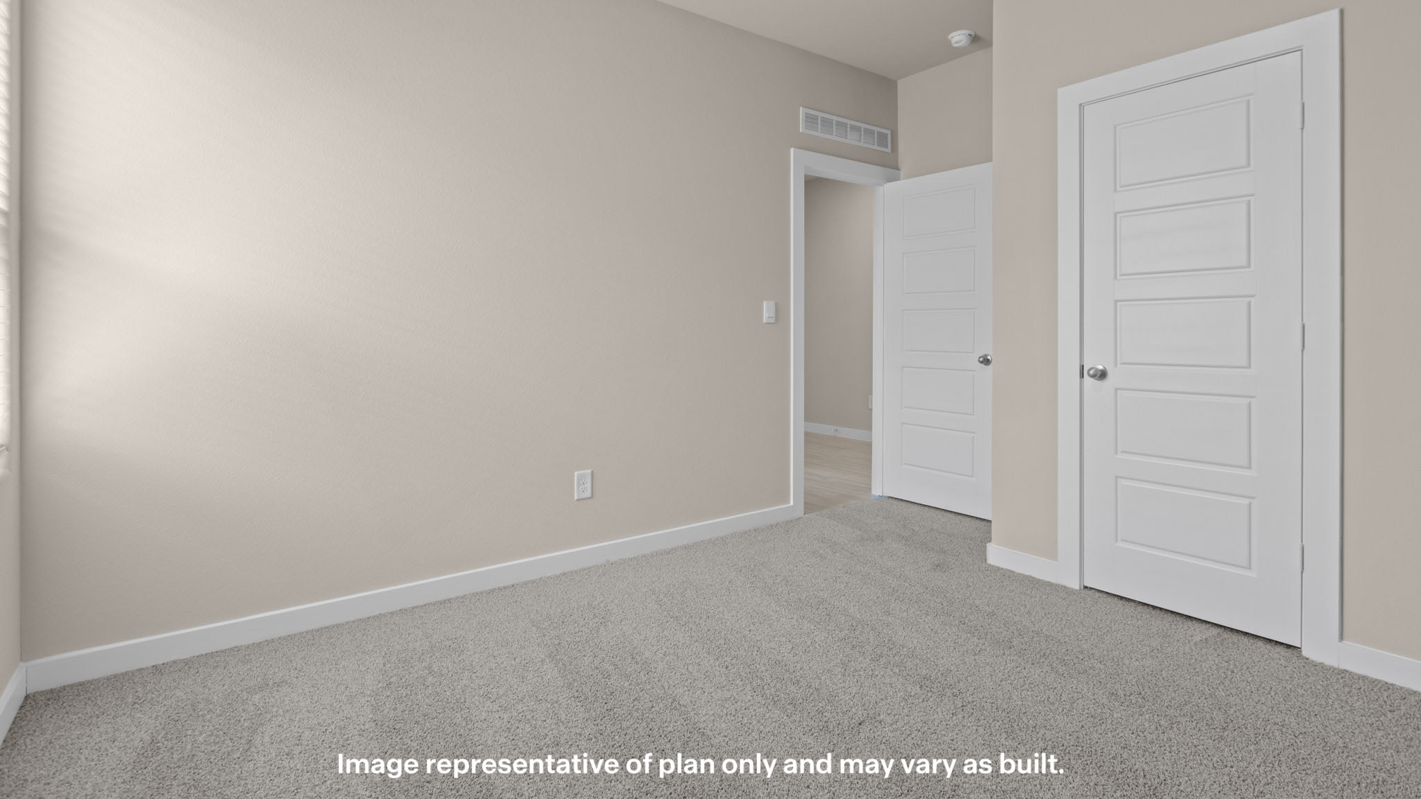 Guest bedroom 2 with side window and plush carpet floor