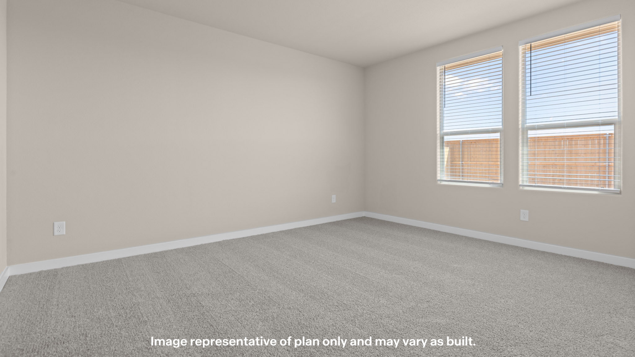 Primary bedroom with plush carpet floors and light allowing double windows