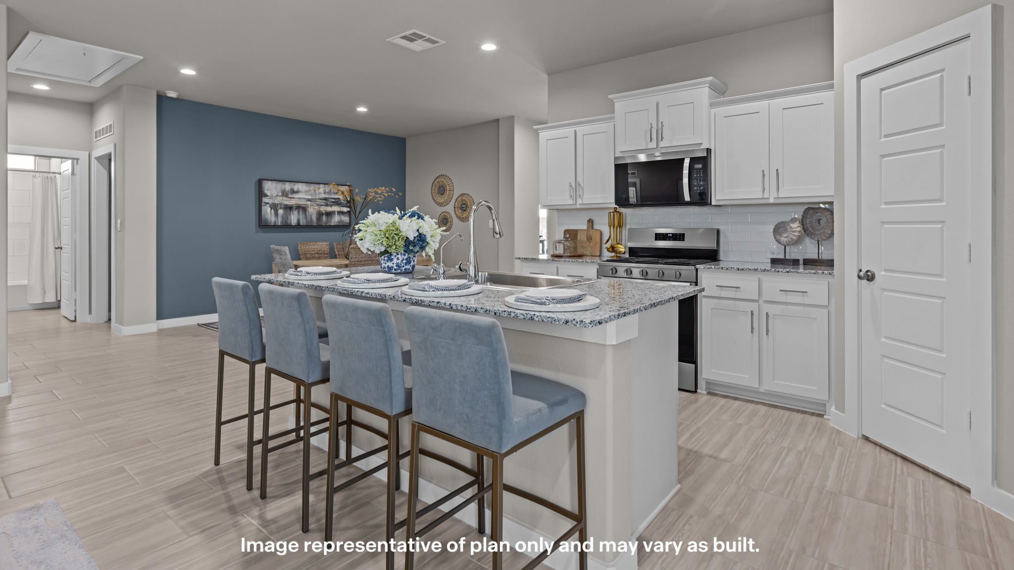 Open concept kitchen with stainless steel appliances, shaker style cabinets, and elevated finishes