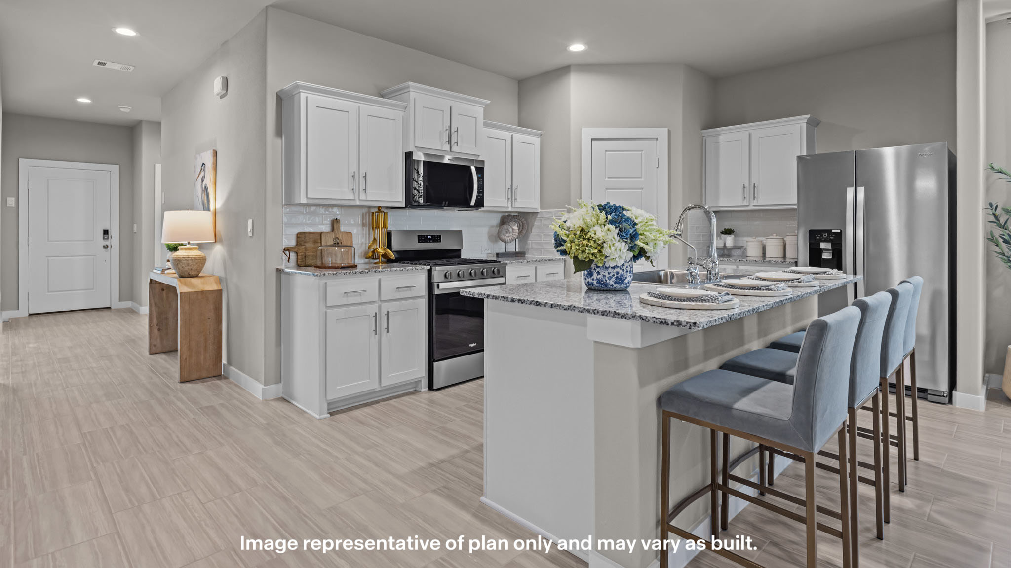 Spacious open concept kitchen with island and counter prep space