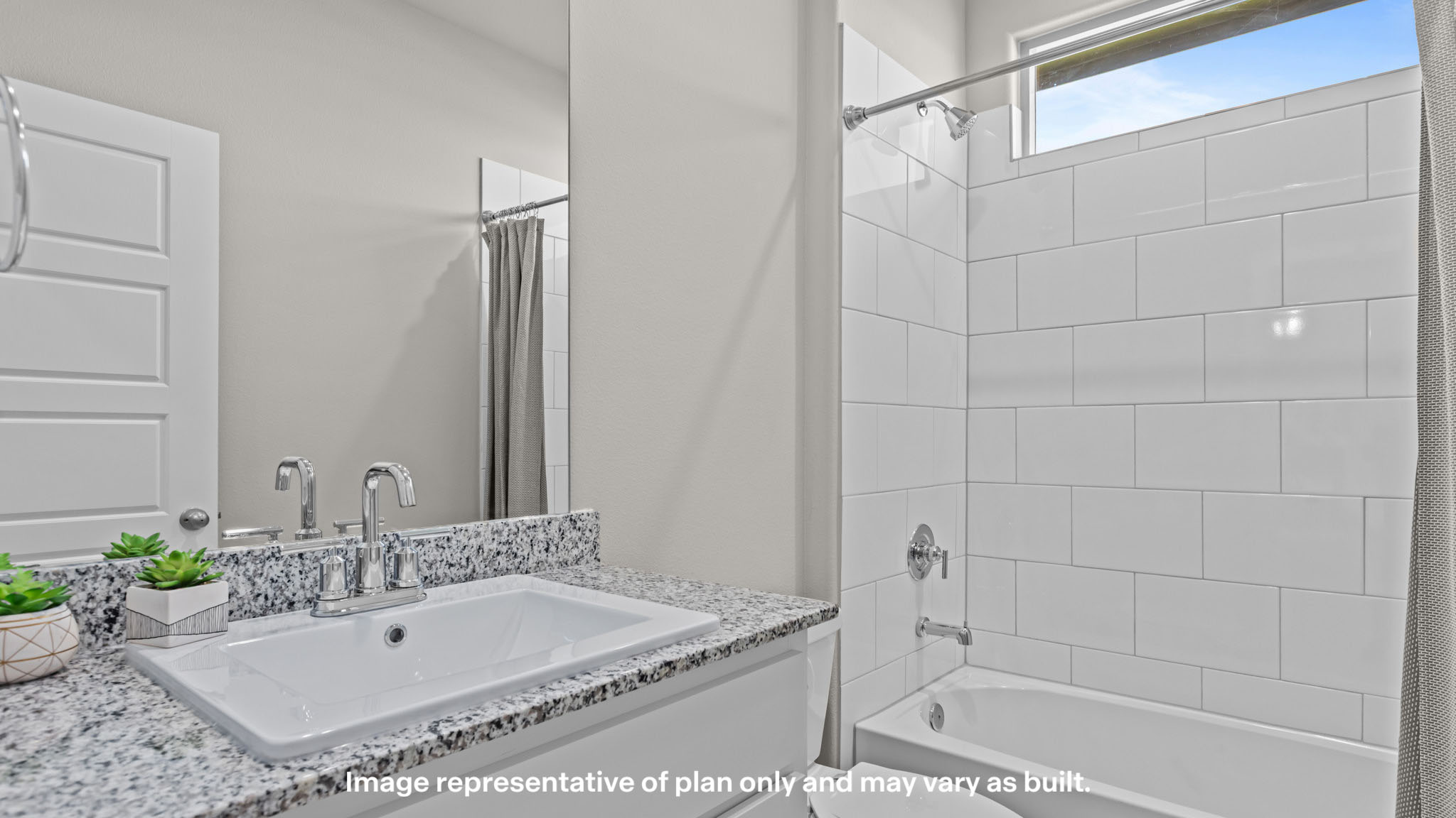 Primary bathroom with luxurious shower and built in storage