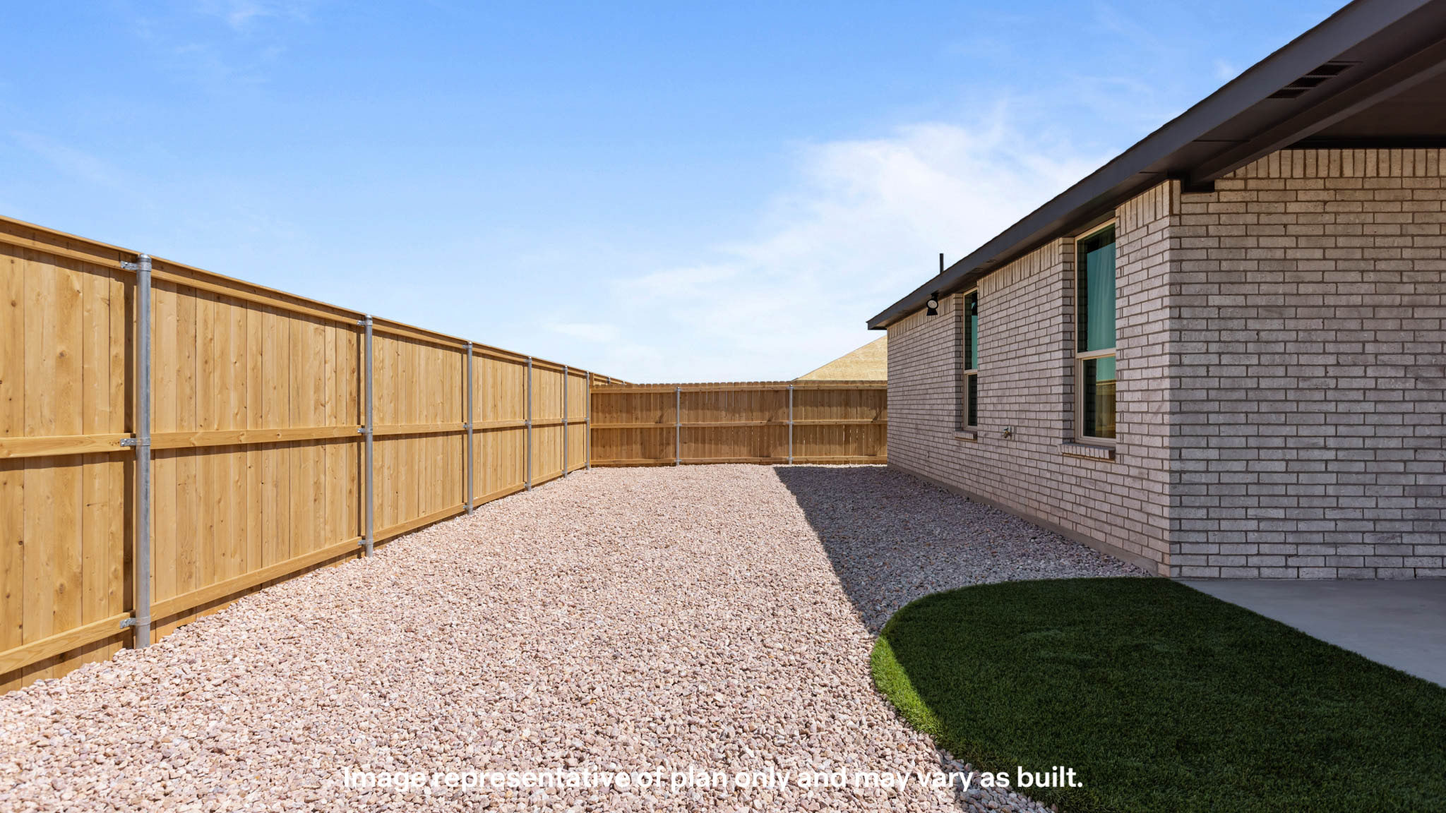 Covered back patio area overlooking spacious backyard
