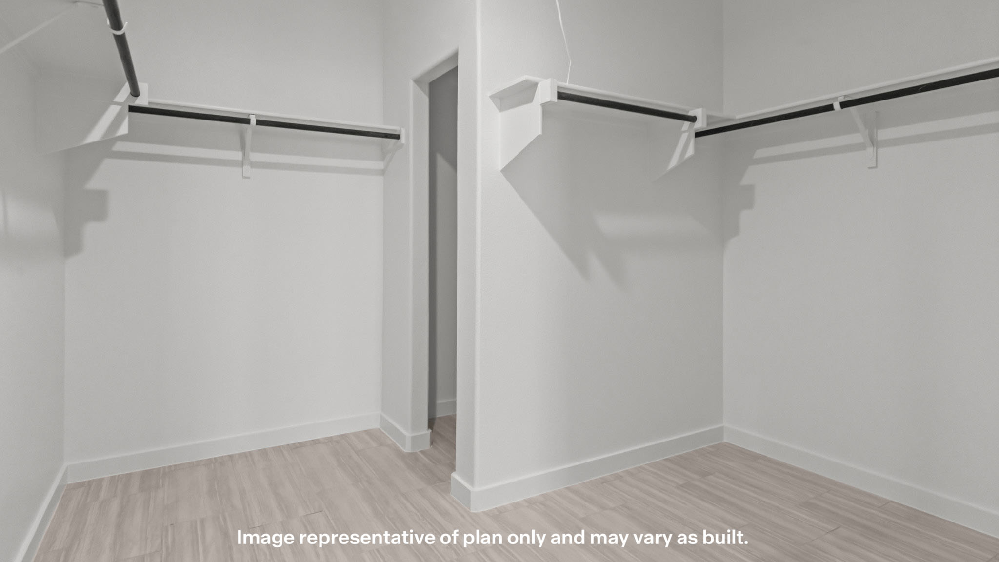 Private primary walk-in closet with extra storage space