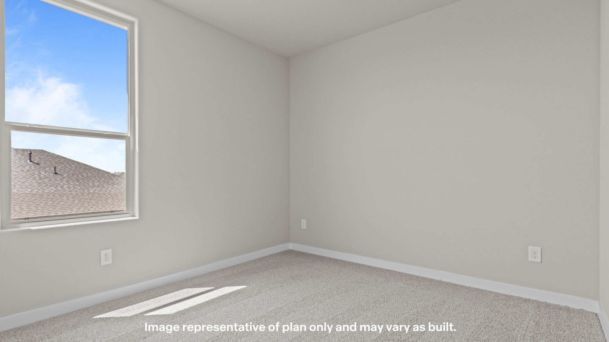 Upstairs guest bedroom 2 with plush carpeted floors and ample natural light