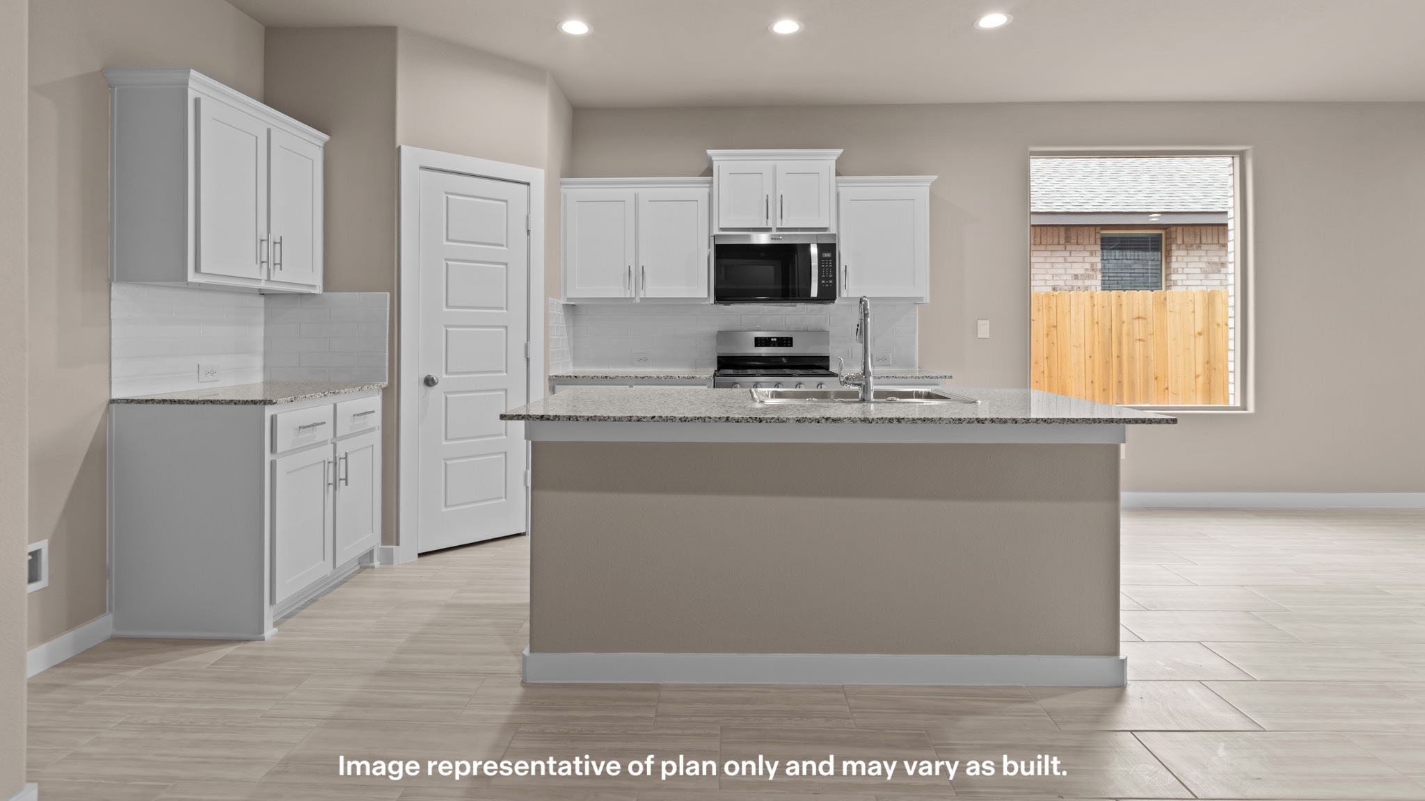 Spacious open concept kitchen with island and counter prep space